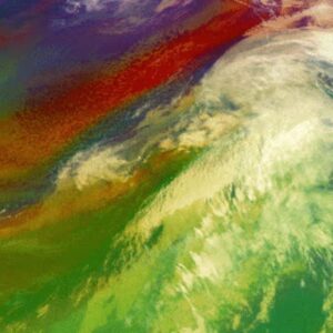 Satellite view of a vibrant weather pattern forming, showcasing swirling clouds and a spectrum of colors from green to red.